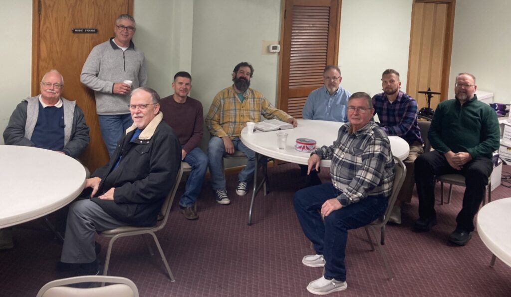 Men's Bible study group, missing a few members due to illness or equipment limitations